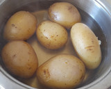 Foto del paso 1 de la receta: Patatas rellenas de jamón -al horno-
