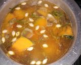 A picture of step 5 of Pumpkin soup with chia seeds toppings, garnished with coriander.