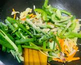 A picture of step 3 of Veg Hakka noodles with spring onions.