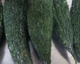 A picture of step 1 of Karela Bharta / karlyache Bharit / bitterguord bharta.