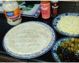 A picture of step 6 of Cheesy Mexican Chicken Fajita Wraps.