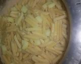 A picture of step 6 of Alfredo penne pasta.