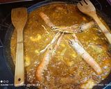 Foto del paso 4 de la receta: Arroz con manitas de conejo, cigalas, sepia y langostinos
