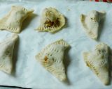 A picture of step 7 of Sweet apple samosa turn over.