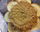 A picture of step 9 of Peach Swiss roll Ice cream Cake.