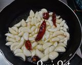 A picture of step 1 of Roshun Er Bhorta/Garlic Bharta.