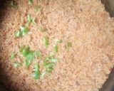 A picture of step 2 of Jollof rice with fried fish.