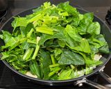 A picture of step 6 of Stir-Fried Spinach and Enoki Mushrooms with Shacha Sauce.