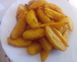 A picture of step 5 of Baked turmeric potato wedges.
