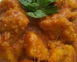 A picture of step 5 of Yam porridge garnished with mint leaf for coolness.