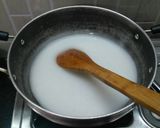 A picture of step 12 of Hibiscus Thai rice balls dunk in coconut milk.