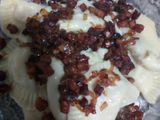 Varenikes de papa con panceta salada