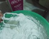 A picture of step 2 of Vanilla cream cake with chocolate chips inside.