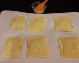 A picture of step 10 of Raspberry White Chocolate Pastry Strudels.
