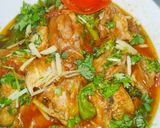 A picture of step 4 of Chicken Karahi with chapati and mango shake.
