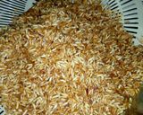 A picture of step 1 of Brown rice with grilled chicken served with macaroni & potatoes.