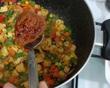 A picture of step 2 of Tom yum shrimp rice.