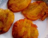 A picture of step 4 of Patacones or Tostones with minced chicken topping.
