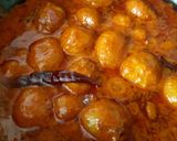 A picture of step 14 of Kashmiri dum aalo.
