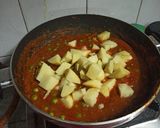 A picture of step 12 of Aloo Matar Curry.