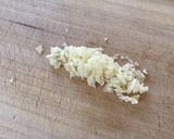 A picture of step 1 of Garlic butter rice with raisins.