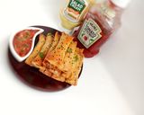 A picture of step 13 of Crunchy chicken filo cigars.