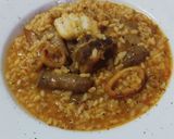 Foto del paso 11 de la receta: Arroz mar y montaña de costillas, salchichas, bacalao y calamar