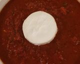 A picture of step 6 of Baked Goat Brie in Spicy Garlic Tomato Sauce.