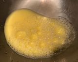 A picture of step 1 of Tomatoes Fried with Egg and Cheese Noodles.
