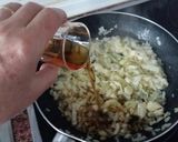 Foto del paso 5 de la receta Manitas de cerdo con tomate, jamón y morro