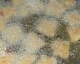 A picture of step 4 of Crispy Semolina tomato & mint bites.