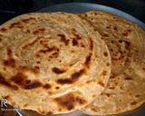 A picture of step 3 of Lachcha paratha with wheat flour and til lahsun chutney.