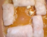 A picture of step 2 of Garlic buttered Prime Hake medallions.