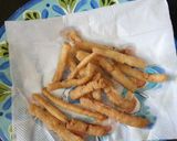 A picture of step 5 of Spicy Rava Fries.