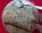 A picture of step 2 of Banana cinnamon bread rolls with chocolate syrup garnish.