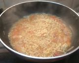 A picture of step 3 of Maggi with tomato onion.