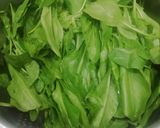 A picture of step 1 of Palak Matar.