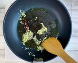 A picture of step 2 of Ajillo with Lots of Umami Taste from Shiitake Powder.