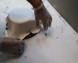 A picture of step 3 of Up in the clouds fondant Birthday cake.