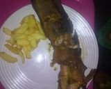 A picture of step 7 of French fries and oven grilled cat fish.