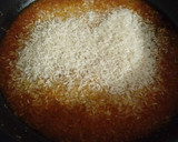Foto del paso 7 de la receta: Arroz caldoso de bogavantes y langostinos al whisky con coquinas al ajillo