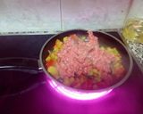 Foto del paso 11 de la receta Pimientos rellenos de carne y verduras con 3 quesos