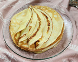 Foto del paso 3 de la receta: 🫔Panqueques rellenos de manzana, pasas y crema, bañados con salsa de chocolate🫔 Canelones dulces