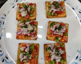 A picture of step 2 of Cream cracker pizza bites.