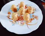 A picture of step 4 of Protein rich healthy roasted chana dal chopped dry fruit and sesame seeds ladoo.