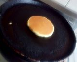 A picture of step 18 of Greek pan cake with honey.