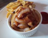 A picture of step 2 of White onion sauce with potato wedges and sauce.