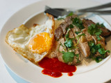 Grilled pork loin served with rice & fried egg
