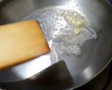 A picture of step 3 of Italian panner ravioli with pink sauce.