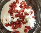 A picture of step 1 of My Pommegranite & Greek Yogurt Breakfast will some Seeds.